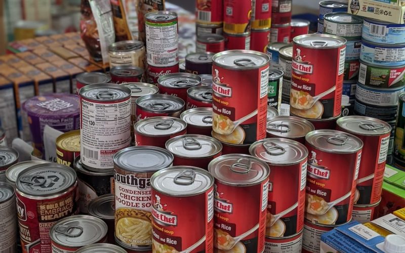 red and white labeled cans