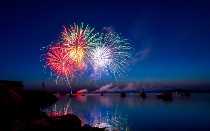 green, red, and white fireworks on sky at nighttime