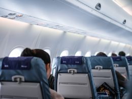 people sitting on gray and white airplane seats