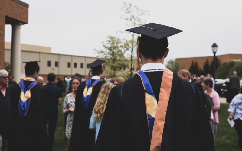 man wearing academic gown